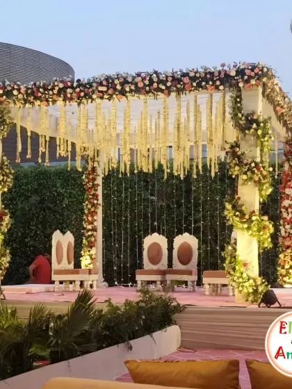 The mandap is the heart of the wedding, and I make sure it is unforgettable. This outdoor mandap features a clean, white structure wrapped in beautiful floral arrangements and hanging jasmine garlands. The soft lighting and elevated platform ensure that all eyes are on the sacred ceremony.