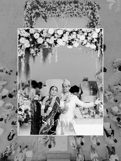 A creative top-down shot of the couple during their beach wedding, capturing the scene in a unique black and white frame.
