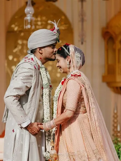 A tender forehead kiss. These are the quiet, intimate moments that we ensure are captured amidst all the wedding chaos.