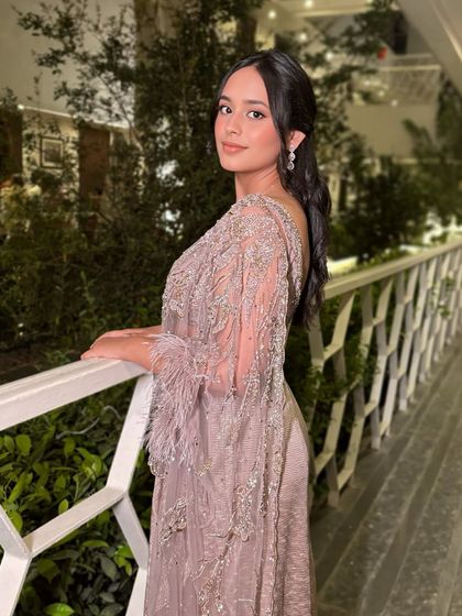 A beautiful shot of this client in a lavender Dolly J saree. The makeup is soft and romantic, with a focus on her eyes.