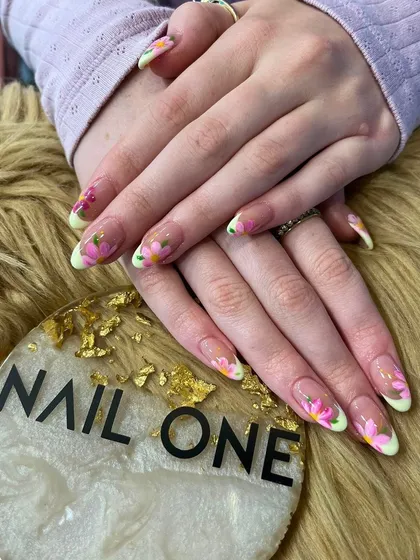 This beautiful floral design features hand-painted pink flowers on a sheer base with soft green tips. It's a fresh, garden-inspired look perfect for any season.
