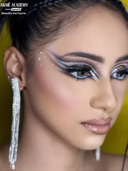 A close-up of the abstract graphic eyeliner. Notice the clean lines and the use of negative space to create a visually striking effect, perfect for editorial and runway work.