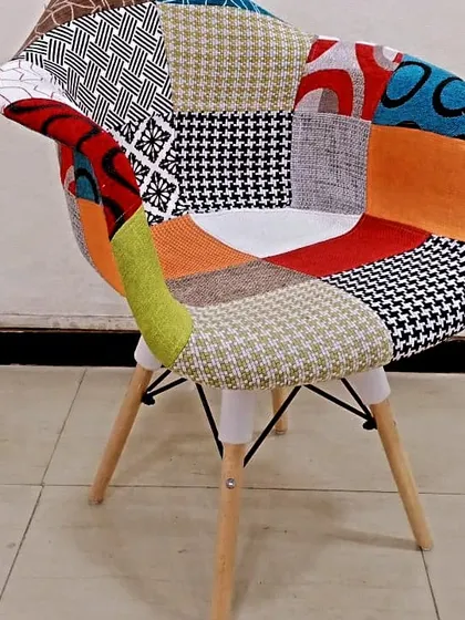 For those who love eclectic style, this patchwork fabric chair combines multiple patterns and colors into one fun and vibrant piece.