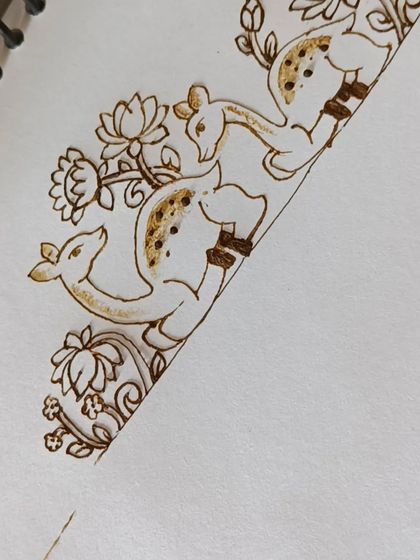 The beginning of a deer startup design, with the floral elements being added around the figures.