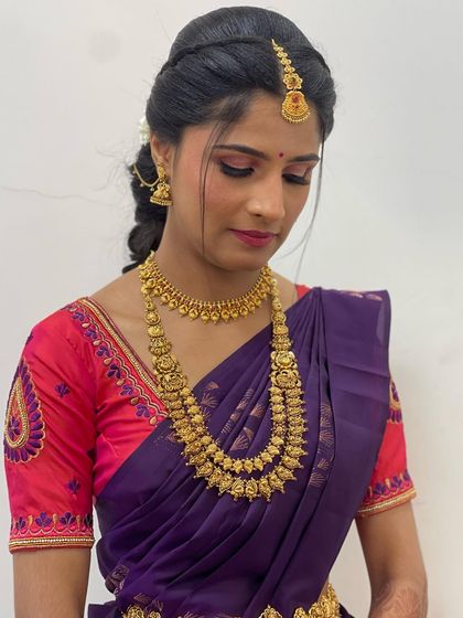 A close-up of the eye makeup, featuring a subtle shimmer and winged liner to define and brighten the eyes.