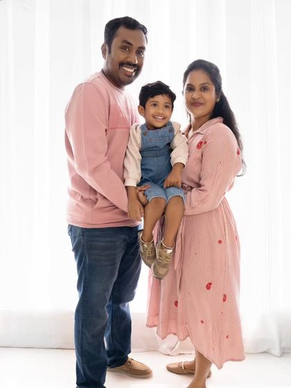 A standing family portrait that captures the family's happy and connected spirit.