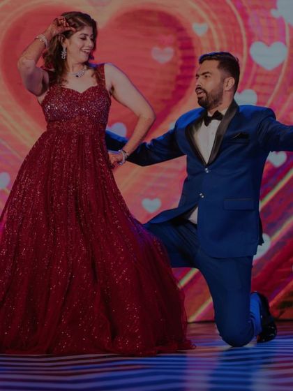 A fun, choreographed pose from the couple's engagement dance performance.