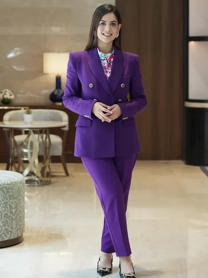 Full-length view of my professional look for a corporate event. I believe in power dressing to command the stage and represent my client's brand with sophistication and style.