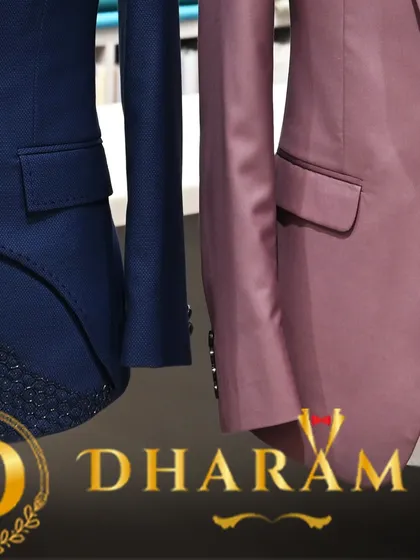A close-up shot of the two suits, with the Dharam Ji logo, highlighting my brand's commitment to quality.