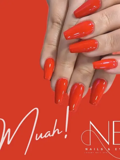 Another look at our classic red, this time on long, coffin-shaped extensions. A bold red nail is always a statement of confidence.