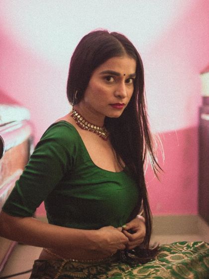 This shot captures a direct and engaging look from the model. The composition and lighting are simple, designed to create an honest and compelling portrait that connects with the viewer.