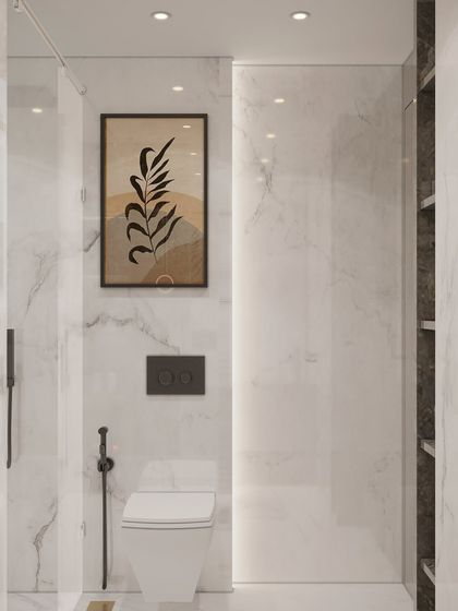 Another look at our bathroom design defined by pristine white and grey marble surfaces. The minimalist art and matte black fixtures offer a modern contrast, creating a cohesive, upscale look rooted in understated luxury.