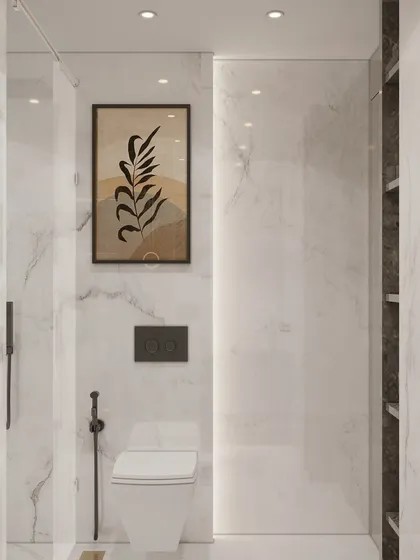 Another look at our bathroom design defined by pristine white and grey marble surfaces. The minimalist art and matte black fixtures offer a modern contrast, creating a cohesive, upscale look rooted in understated luxury.