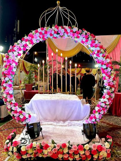Here is a look at the Crown entry prop before the event, showcasing the intricate golden frame, the floral arch, and the elegant candle holders. We can customize the flower colors to match your theme.