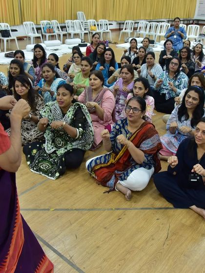 Teachers at Fravashi Academy fully engaged in a hands-on activity. My workshops are not about lecturing; they are about experiencing the story.