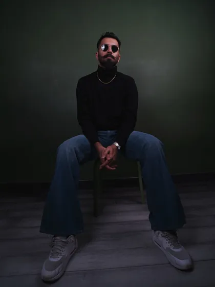 A full-length studio shot showcasing my preferred silhouette with a black turtleneck and vintage-inspired wide-leg jeans. This look is ideal for classic men's apparel campaigns.