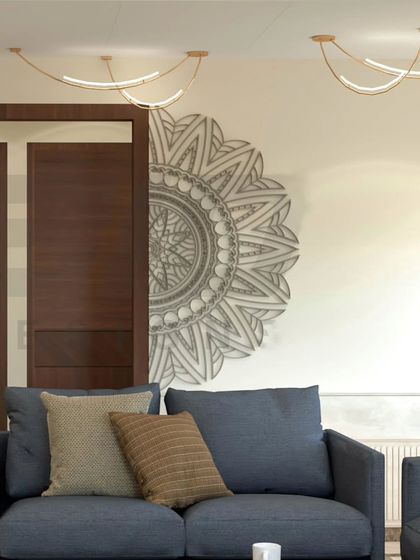 A half-mandala mural designed for a living room in Bangalore, perfectly complementing the modern furniture and minimalist decor. This type of wall art adds a spiritual and aesthetic anchor to the space.