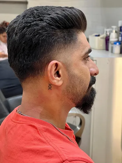 Elevate your style with a perfect fade. This cut is classic, sharp, and always in style.