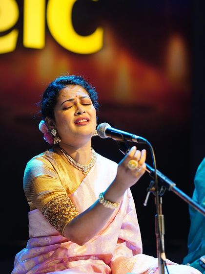 Priyanka Barve completely absorbed in her performance, styled in a beautiful pastel pink Banarasi saree.