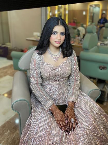 This engagement bride looks so elegant and poised. The makeup is soft and understated, letting her natural beauty shine.