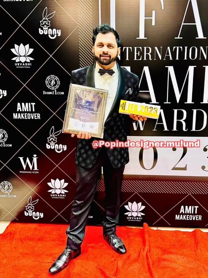 A client looking confident on the red carpet in a black quilted-pattern tuxedo. This is one of my more unique formal pieces, perfect for making a fashion statement.