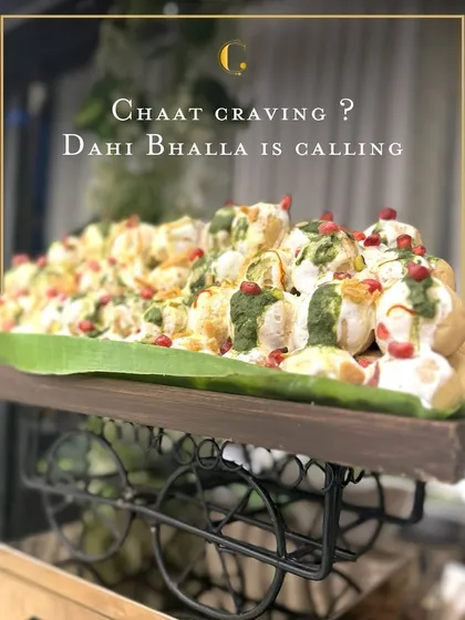 We elevate street food favourites into gourmet experiences. Our Dahi Bhalla is served from a charming, custom-designed cart, piled high on a banana leaf and garnished with fresh pomegranate and chutneys for a delightful burst of flavour.