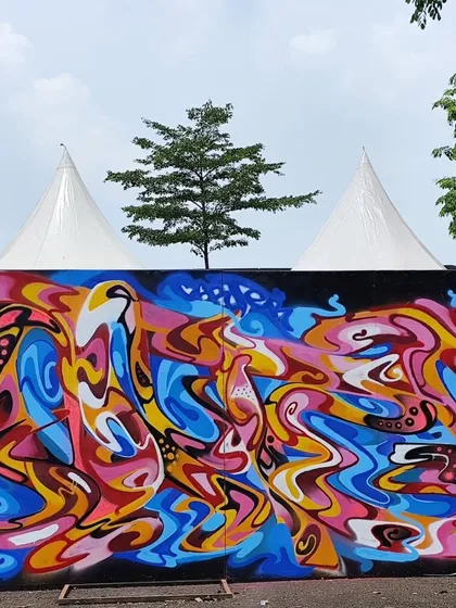 The full abstract mural from the event in Jakarta. The piece is a riot of color and movement, designed to be visually overwhelming in the best way.