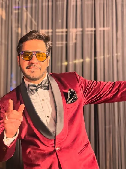A cool, confident pose. Ready to rock the party and make sure everyone has a great time.