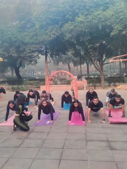 A group of us holding a strong plank during an outdoor morning session. This kind of bodyweight training is excellent for building core strength and endurance.