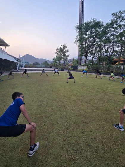 A proper warm-up and cool-down prevents injuries and improves performance. Our summer camp fitness sessions include structured group stretching exercises to ensure players maintain flexibility and recover effectively.