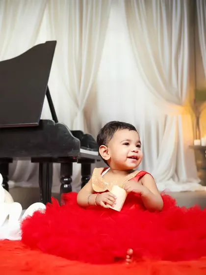 A sweet, candid moment of the birthday girl sitting on the floor during her piano session.