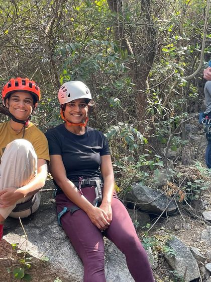 Two friends enjoying a moment of rest at the crag. The supportive and friendly atmosphere is what makes our community special.