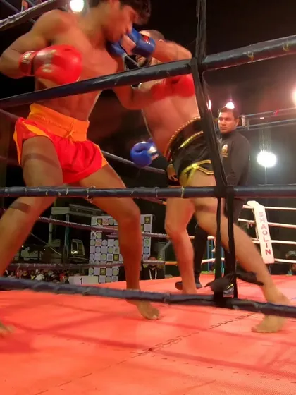 Trading heavy blows in the corner of the ring. This is what a high-level kickboxing bout looks like.