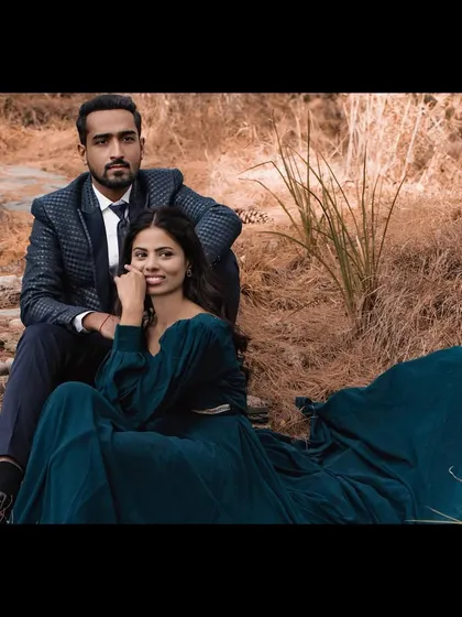 A dramatic and romantic pre-wedding look. The bride's makeup is elegant with a defined eye, paired with soft waves that complement her flowing gown.