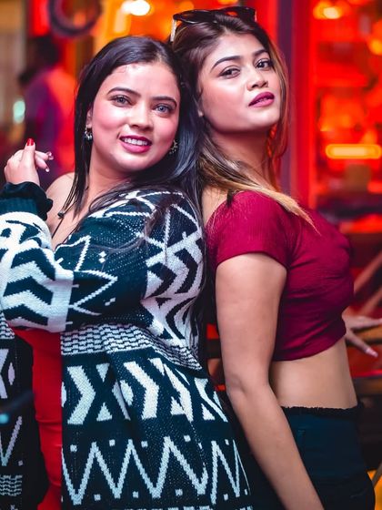 Posing for a picture during a fun night out. The energy at my gigs is always perfect for making new memories.