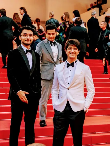 A great shot from the Cannes red carpet, featuring two of my creations side-by-side: a classic black tuxedo and a striking white one.