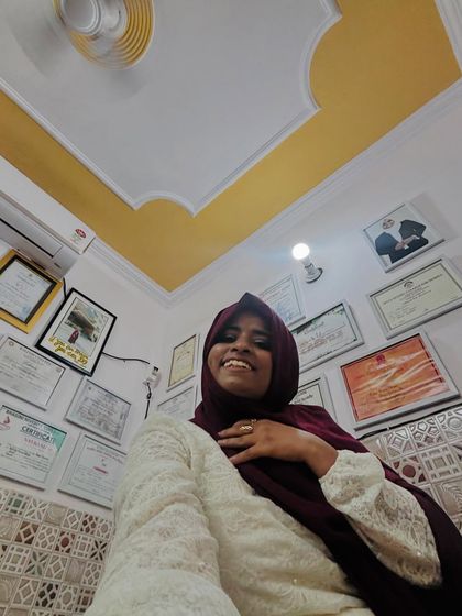 Another view of me in my studio, with my wall of fame. These certificates from various competitions and courses motivate me to keep learning and teaching.