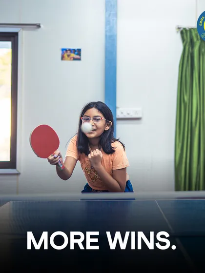 Sports should be fun, and this young player proves it. Here she is, focused and determined during a table tennis match in our air-conditioned indoor zone, showing that skill and enjoyment go hand in hand.