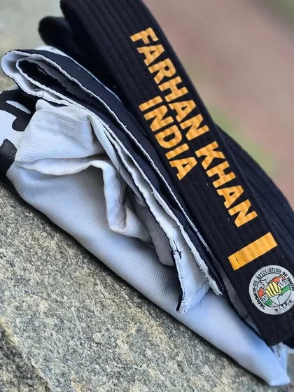 A close-up of my personalized black belt, a symbol of my journey and dedication to the art.