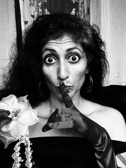 A playful and mysterious black and white portrait. As an artist, I believe in making a difference and saying no to mediocrity, and this image captures that spirit.