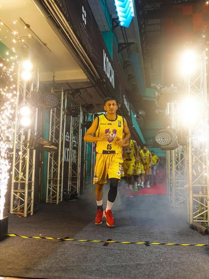 A player makes a dramatic entrance through a tunnel of pyrotechnics at the INBL basketball league. We design these high-impact player entries to energize the crowd and the athletes.