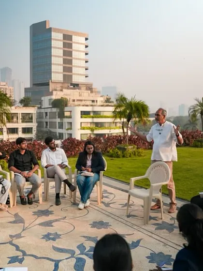 Rahul Kadri engaging with students against the Mumbai skyline, discussing the critical role of civil engineers in creating equitable urban spaces.