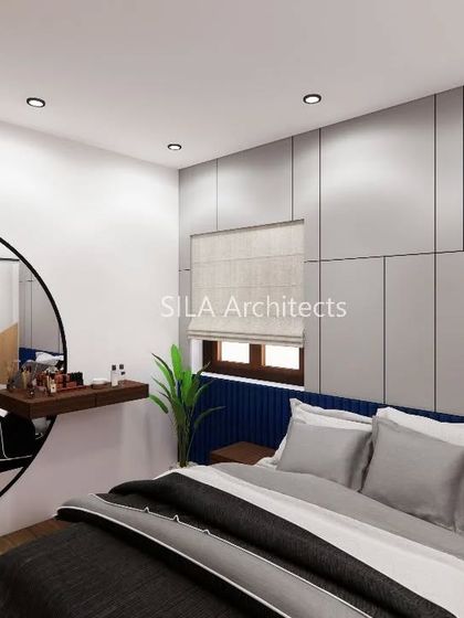 A bedroom concept for the Vizag project, with a large circular mirror and a blue upholstered headboard creating a bold focal point.