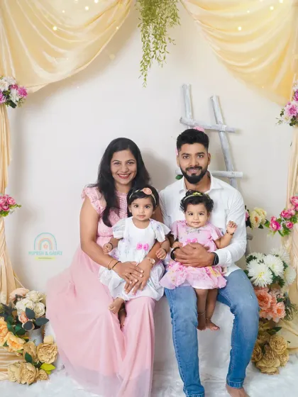 A classic family portrait in our studio. We coordinated outfits and our soft, floral backdrop to create a beautiful and cohesive look for this family of four.