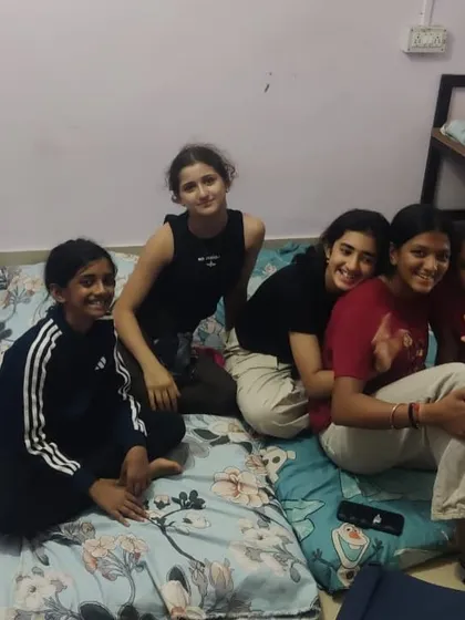 Downtime at the training camp. Our athletes relax and bond in their dorms after a hard day of training, fostering the family-like community we cherish at Trackblazers.