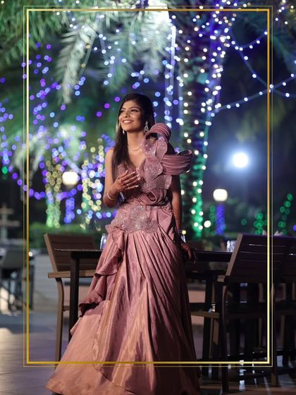 This client chose a unique mauve gown with a dramatic, structured shoulder detail. It's a high-fashion look perfect for making a bold statement at a reception.