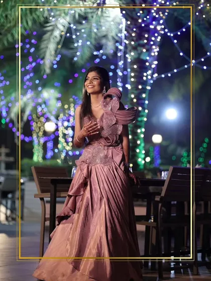 This client chose a unique mauve gown with a dramatic, structured shoulder detail. It's a high-fashion look perfect for making a bold statement at a reception.