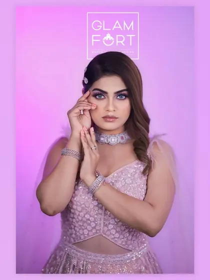 A soft and dreamy party look with a pink theme. The makeup features subtle shimmer on the eyes and a soft pink lip, creating a very elegant and feminine style.