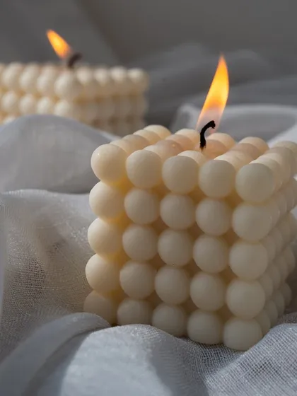 A simple, beautiful shot of our large bubble candles, lit and creating a cozy atmosphere.