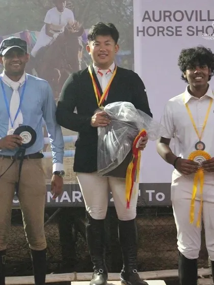 Our trainer Barath Manoharan on the podium after conquering multiple categories at the show jumping competition in Pondicherry.